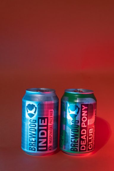Creatively lit cans of beer with red lighting, photographed by Leeds-based food photographer Elizabeth Wood.