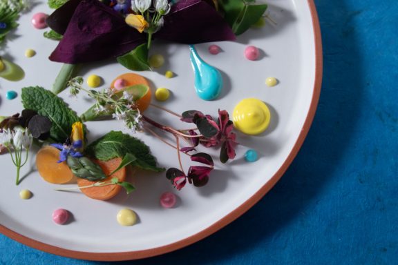 A beautifully plated gourmet dish with vibrant colors, photographed by Leeds-based food photographer Elizabeth Wood.